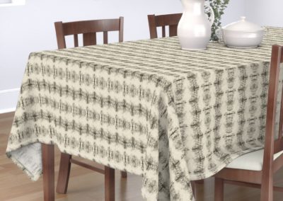 Tablecloth with grail like shapes catching and releasing in a dreamy univers. In pristine (off white) and black color play. One out of three print scales.