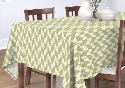 "Geo Ball" tablecloth with hexagon pattern in green and pristine (off-white/beige) color play. Inspired from geometry in nature.
