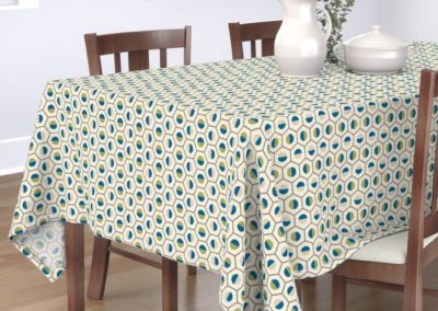 Tablecloth in geometric hexagon shaped color symphony. Colors are green, blue, sand and pristine (off white/beige). Inspired from geometry in nature.