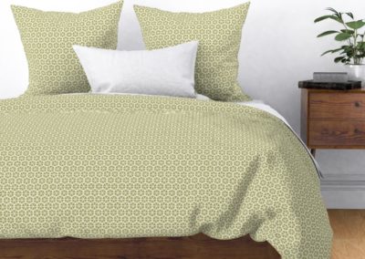 Bedding, duvet and pillow cover with hexagon shaped geometric flowers. Colors are green and pristine (off white/beige). Inspired from geometry in nature.