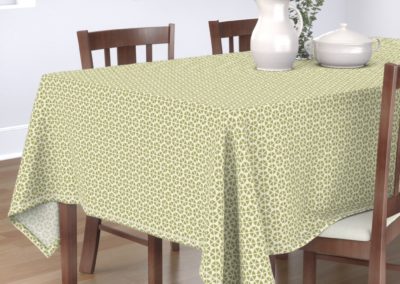 Tablecloth with hexagon shaped geometric flowers. Colors are green and pristine (off white/beige). Inspired from geometry in nature.